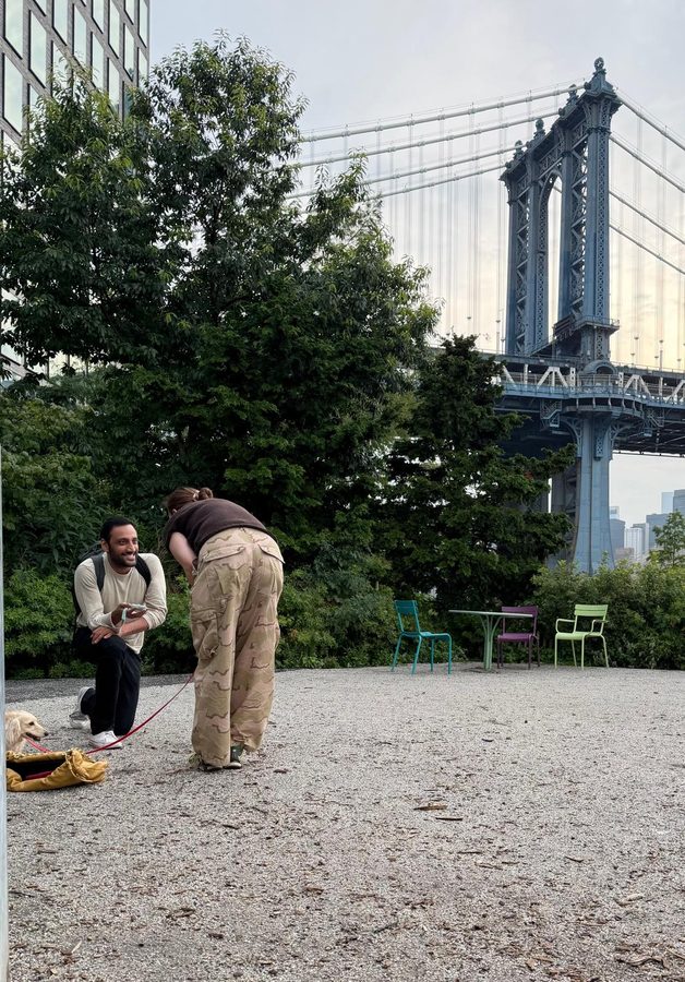 Rob proposing to Jen under the Manhattan Bridge